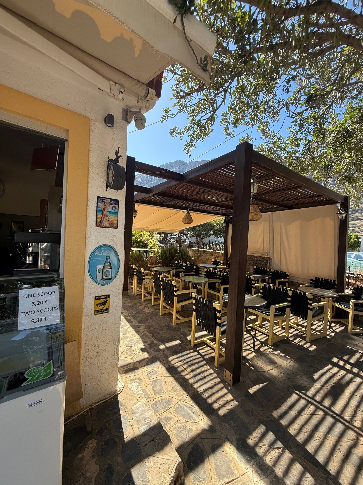 Shaded pergola terrace at The Island café